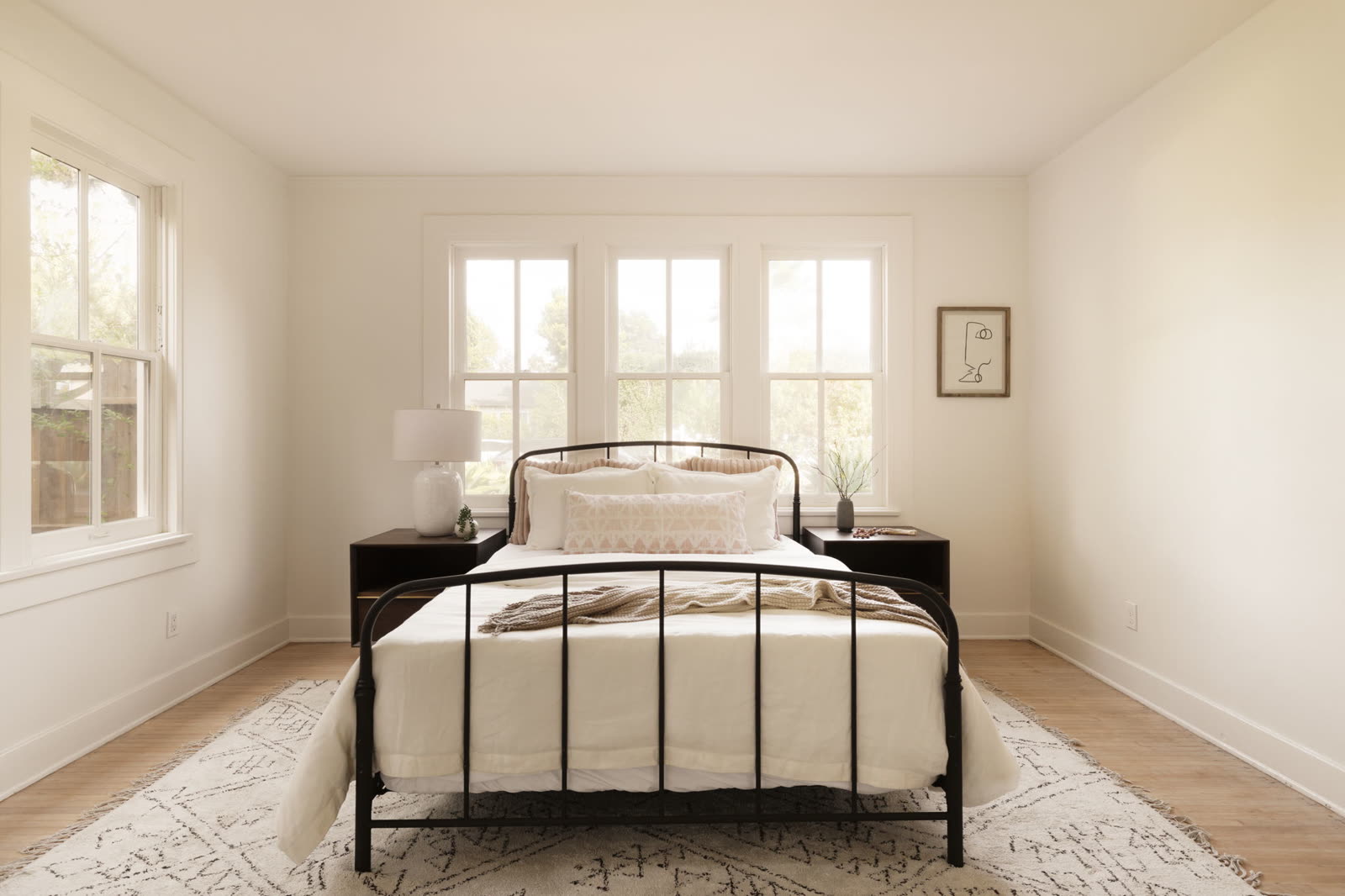 Serene bedroom with triple windows